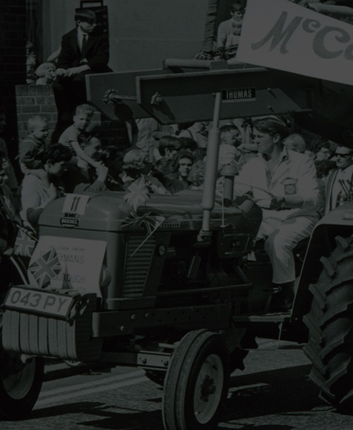 Historical black & white photo - Tractor going down road in Scarborough UK