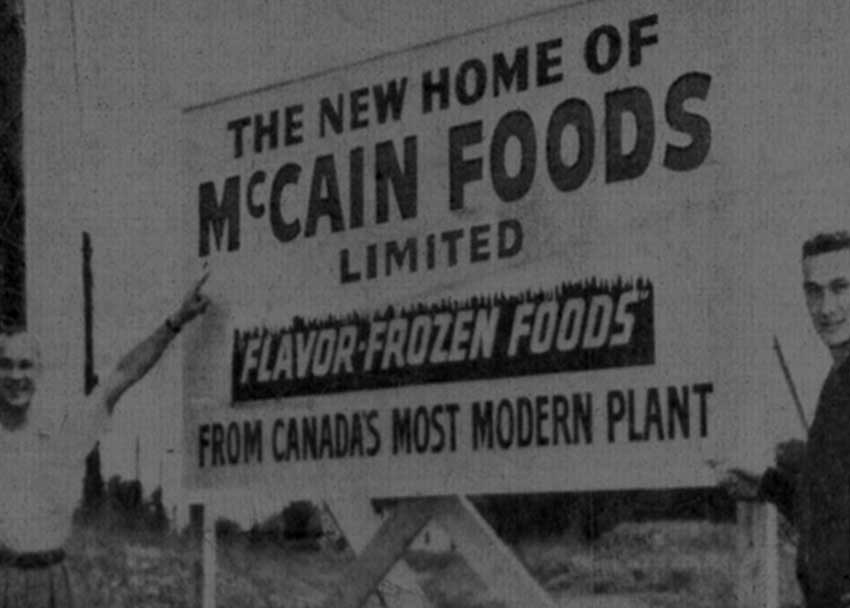  historical McCain Foods Limited sign with two McCain brothers.